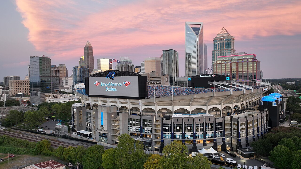 Bank of America Stadium's curved exterior and entry gates from street level